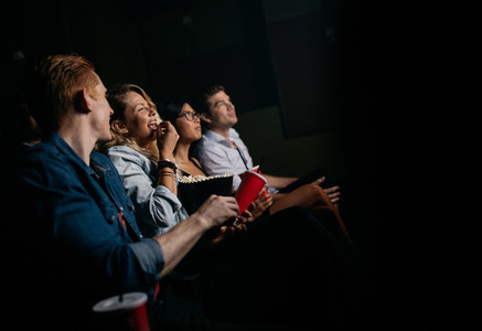 Group of people watching movie in cinema