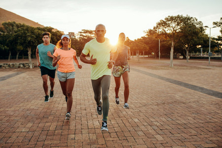 Group running outdoors in evening