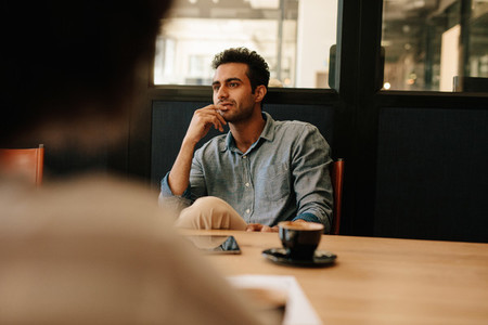 Man during business meeting in conference room