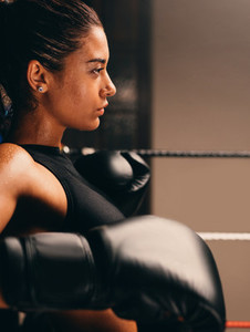 Side profile view of female athlete wearing gloves