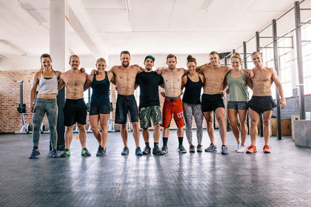 Large group of bodybuilders in crossfit gym