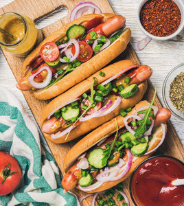 Homemade hot dogs with vegetables  ketchup  mustard and spices