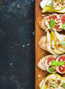 Crostini with pear  ricotta cheese  figs  nuts and fresh herbs