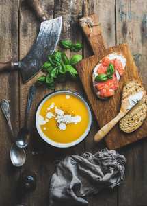 Dinner or lunch with pumpkin cream soup and toasts