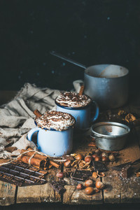 Hot chocolate with whipped cream different nuts and spices