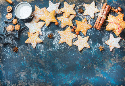 Christmas star shaped cookies with baking molds and spices