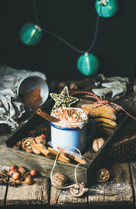 Mug of hot chocolate  garland with blue balls at background