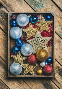 Christmas tree toy stars balls and garland in wooden box