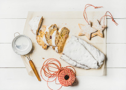 Traditional German Christmas cake Stollen cut in pieces cookies rope
