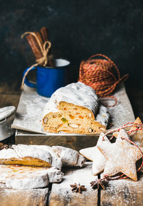 Traditional German Christmas cake Stollen with festive gingerbread cookies