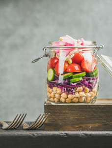 Close up of Healthy layered take away salad with vegetables  chickpea sprouts