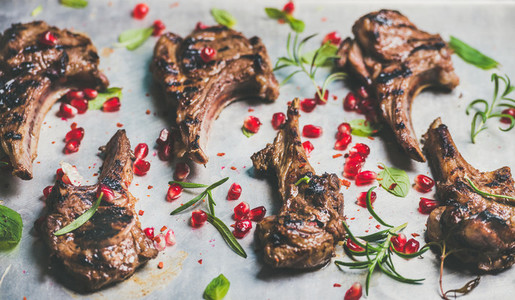 Grilled lamb ribs with pomegranate seeds and herbs