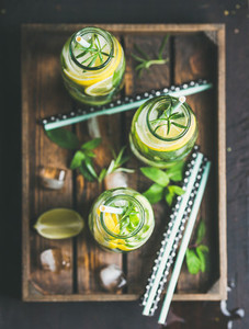 Citrus and herbs infused sassi water in wooden tray