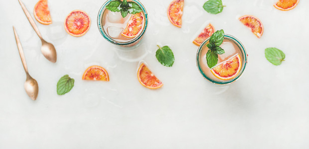 Homemade blood orange lemonade with mint and ice cubes