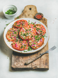 Fresh heirloom tomato  parsley and onion salad  Clean eating food