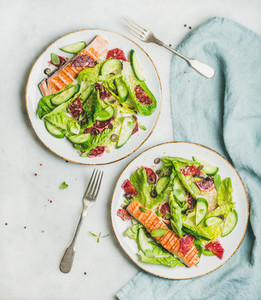 Healthy spring salad with grilled salmon  orange  olives and quinoa