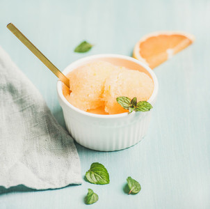 Pink grapefruit homemade sorbet with fresh mint leaves
