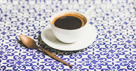 Cup of black Turkish or Eastern style coffee selective focus