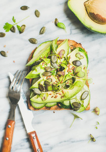 Healthy green veggie breakfast concept with sandwich top view