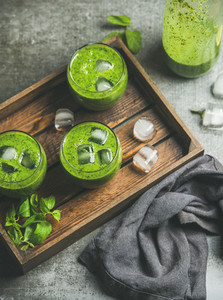 Fresh green smoothie with ice cubes  mint and lime
