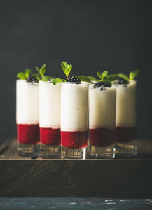 Dessert in glass with blackberries and mint  copy space