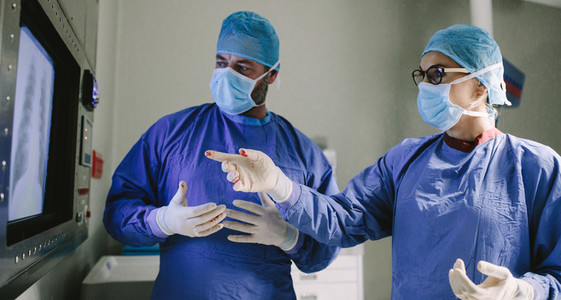 Team of surgeons using new technology on surgery