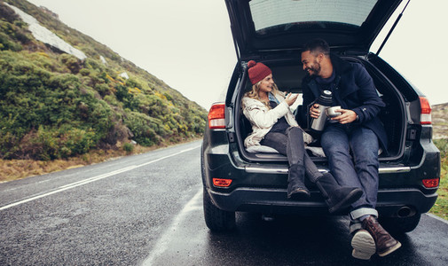 Couple having a coffee break during road trip