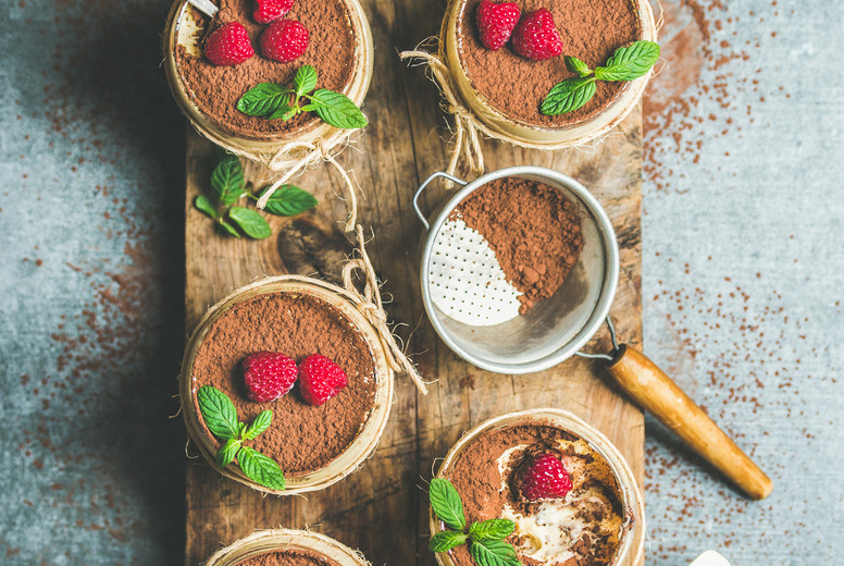 Homemade dessert Tiramisu in glasses on wooden board