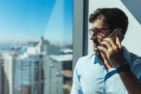 Closeup of a business investor talking on phone