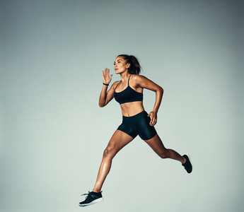 Female athlete doing running exercise