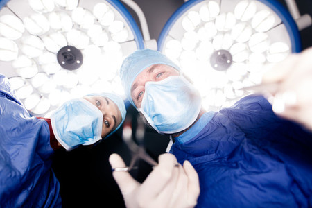 Doctors performing dental surgery
