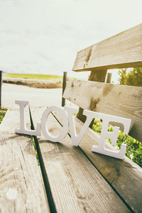 Word love over a bench