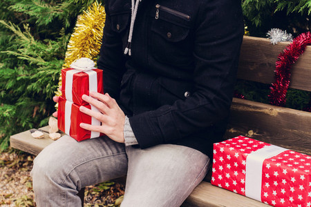 Young man and christmas gifts