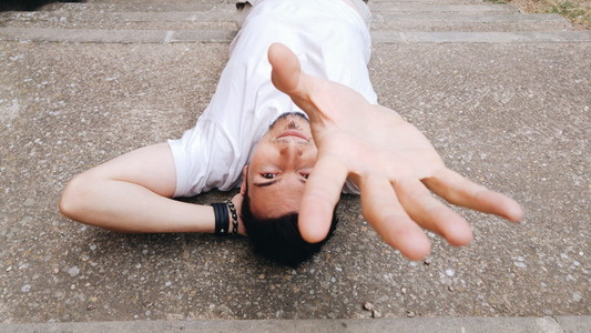 Young man lying on floor