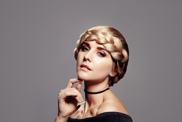 Sensual woman with perfect skin and braided hair style