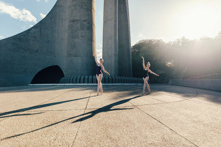 Female ballet dancers practicing duet dance