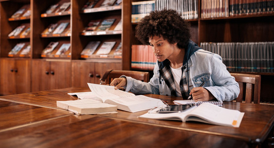 Young afro american student preparing for exam