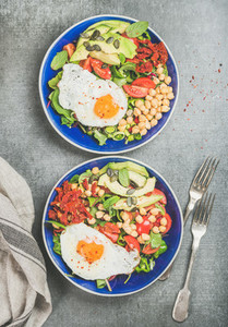 Clean eating concept breakfast with fried egg  chickpea  vegetables  seeds