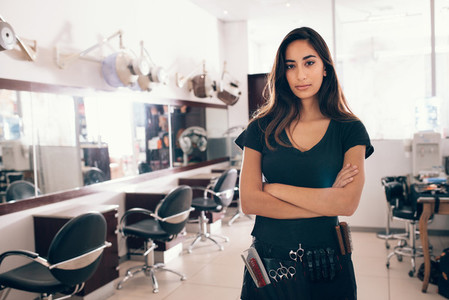 Portrait of female hairstylist looking at camera