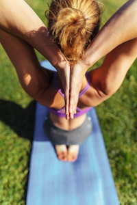 Woman practising yoga outdoors