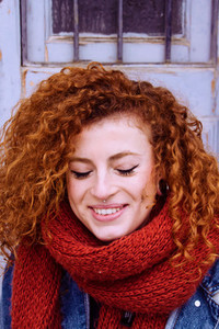 Young woman with a red scarf