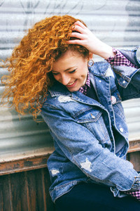 Cool and young redhead woman