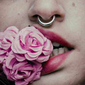 Close up of mouth and roses