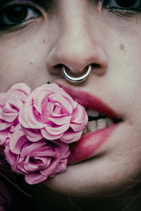 Close up of mouth and roses