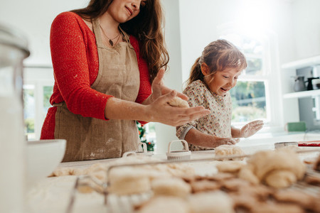 Mother and child making cookies for Christmas