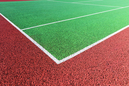 Baseline on green hard tennis court