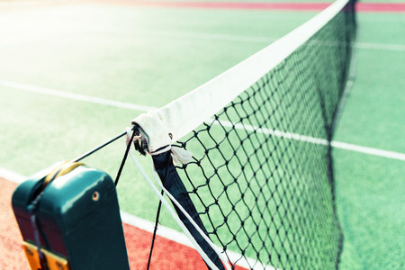 Tennis court net in sunlight