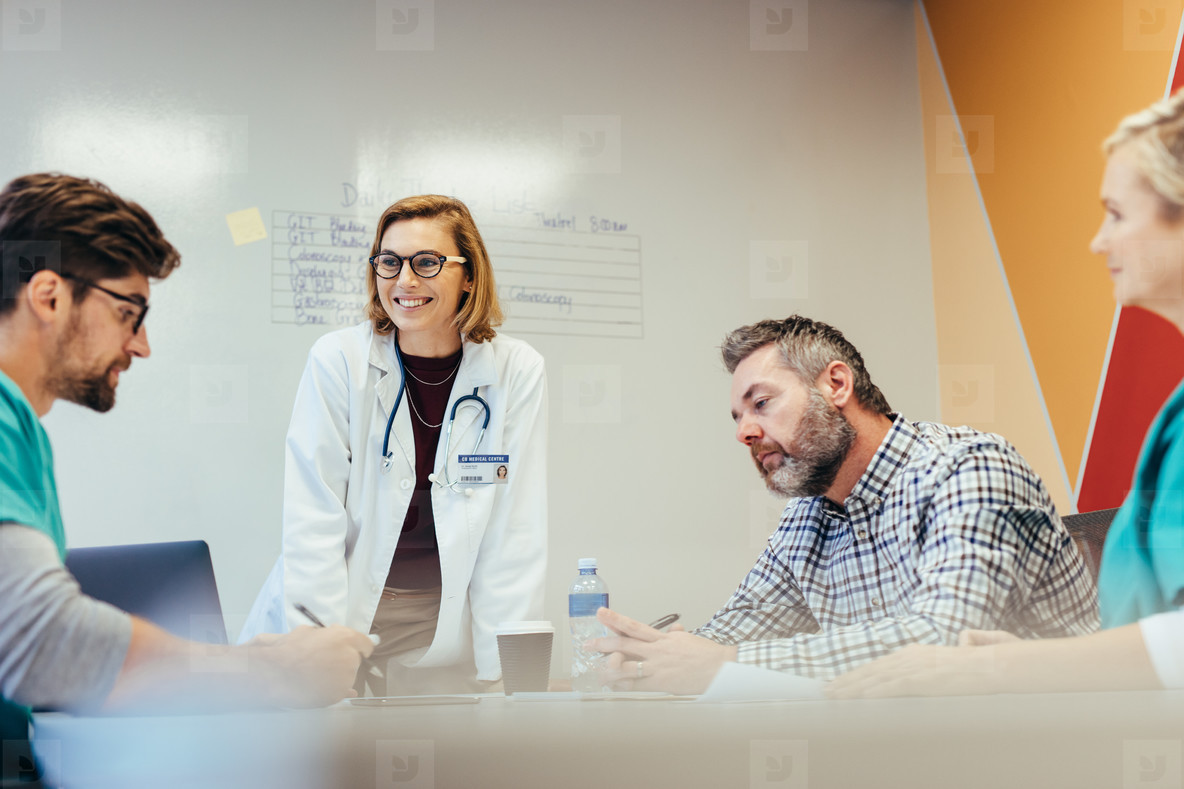 Hospital staff meeting in conference room