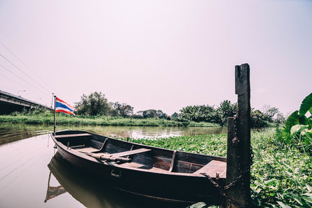 Thai boat docked in the river