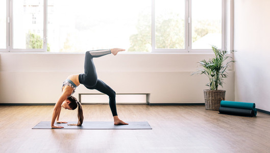 Woman practicing yoga for good health